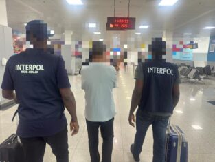 Nigerian police repatriates wanted Chinese gang leader