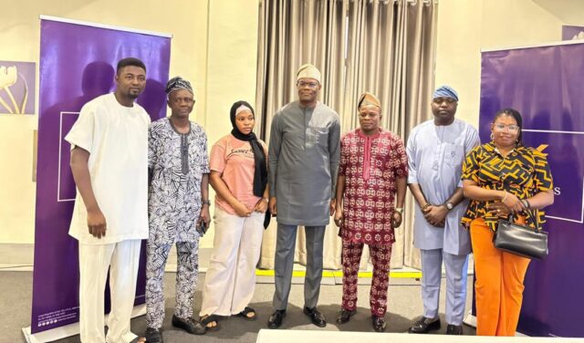 Photo caption: Chris Ofikulu, Executive Director, Retail & Commercial Banking, Polaris Bank Limited with some Customers at the South West Trade Forum sponsored by the bank.