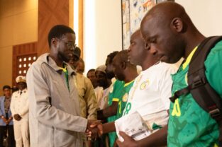 Senegal football fans return home after royal pardon in Morocco