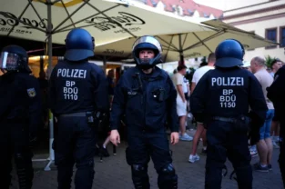 Police in Budapest review footage after fan brawl Champions League final